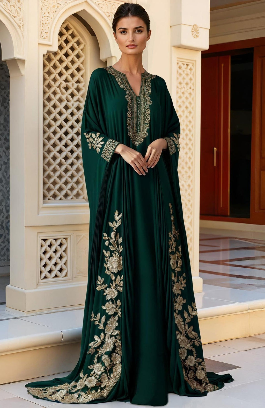 Deep green floor-length kaftan with gold Kashmiri tilla embroidery on neckline, sleeves, and hem.