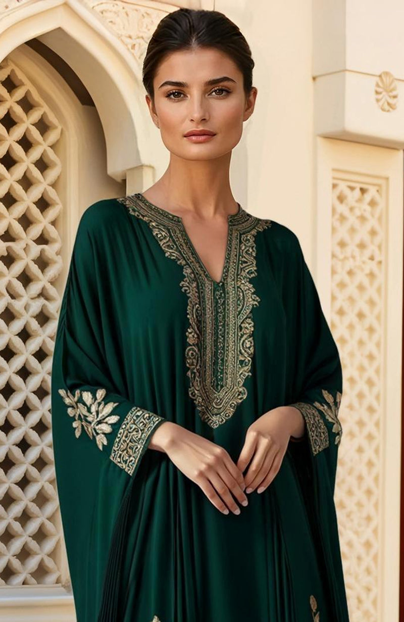 Deep green floor-length kaftan with gold Kashmiri tilla embroidery on neckline, sleeves, and hem