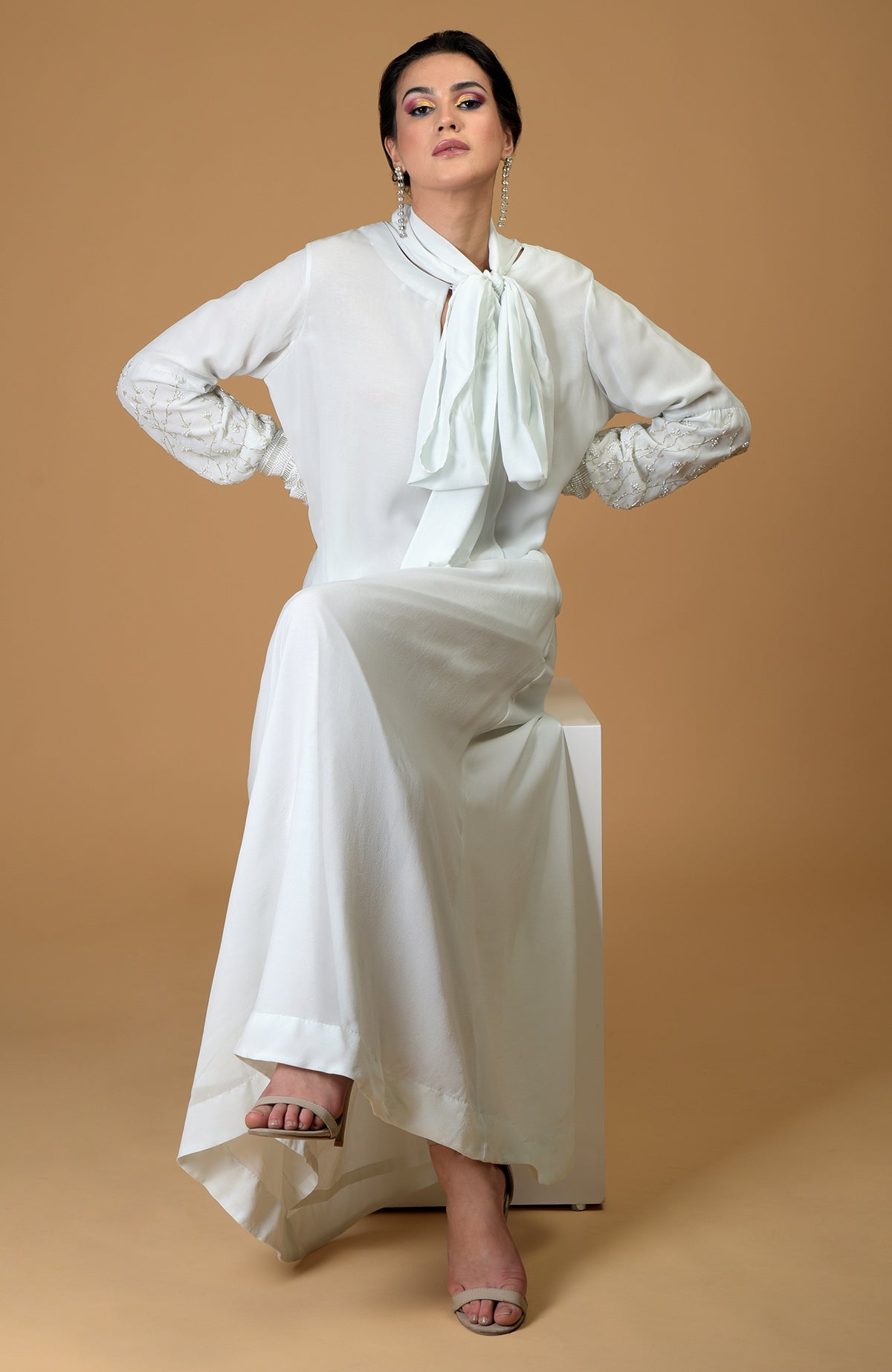 Ash grey silk georgette gown with hand-embroidered sleeves and an elongated neck scarf.