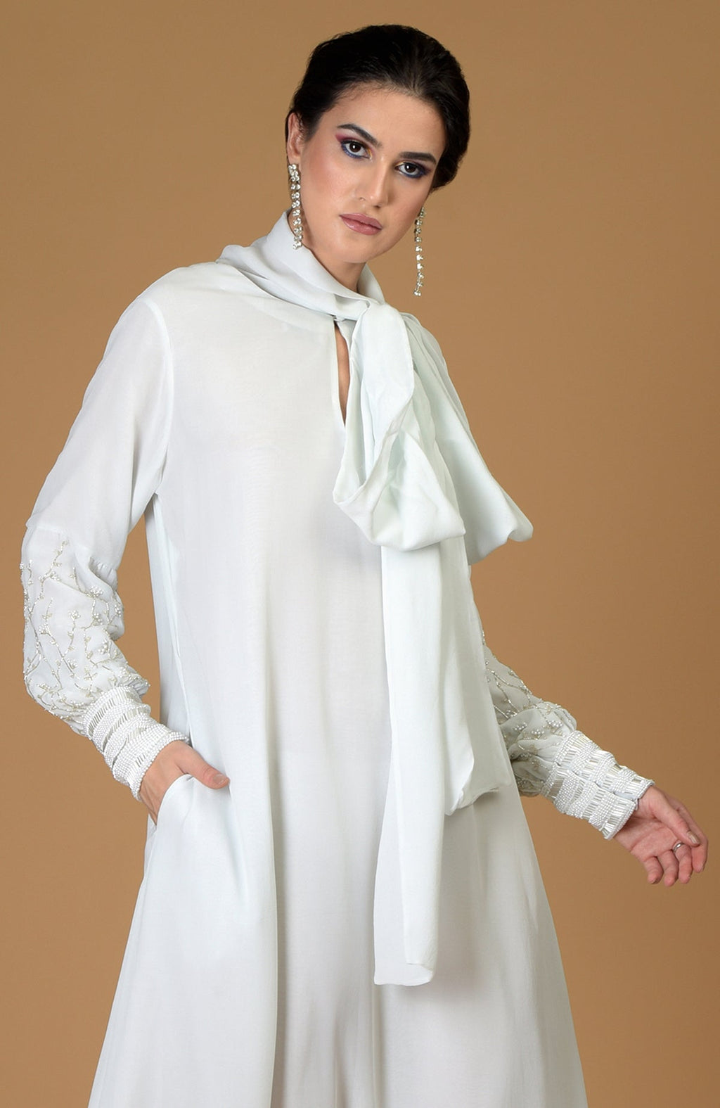 Ash grey silk georgette dress with hand-embroidered sleeves and a neck scarf.