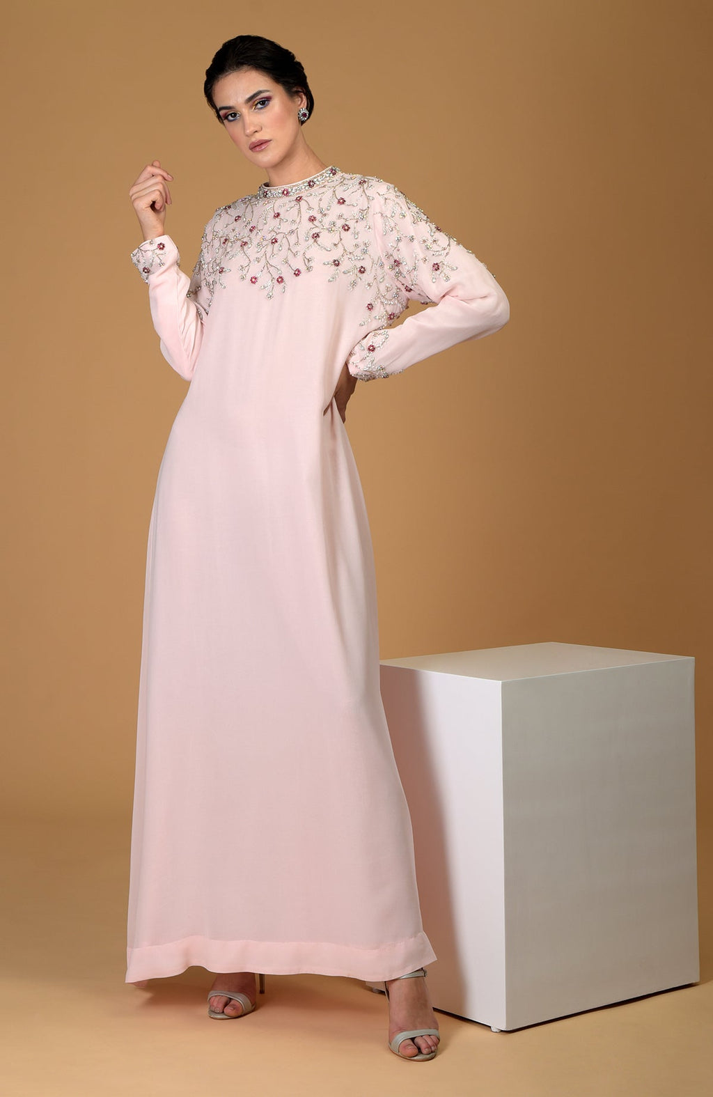 Pale pink hand-embroidered dress with crystal and bead embellishments.