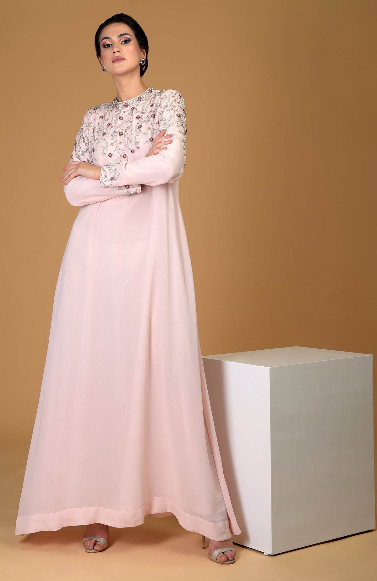 Pale pink hand-embroidered dress with crystal and bead embellishments.