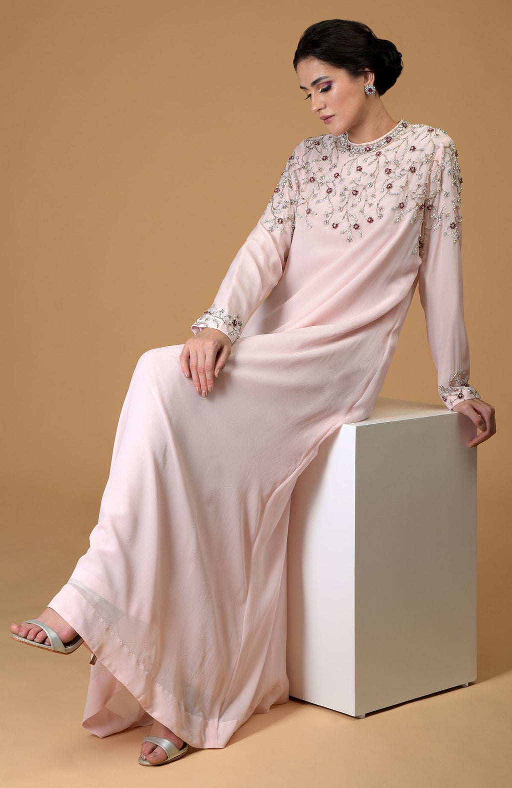 Pale pink hand-embroidered dress with crystal and bead embellishments.