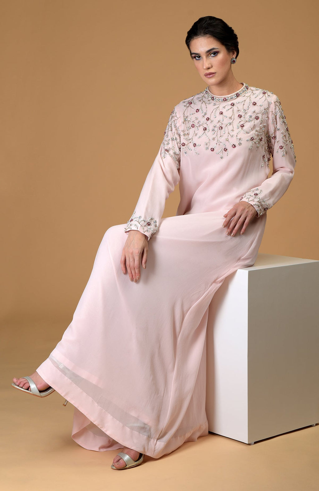 Pale pink hand-embroidered dress with crystal and bead embellishments.