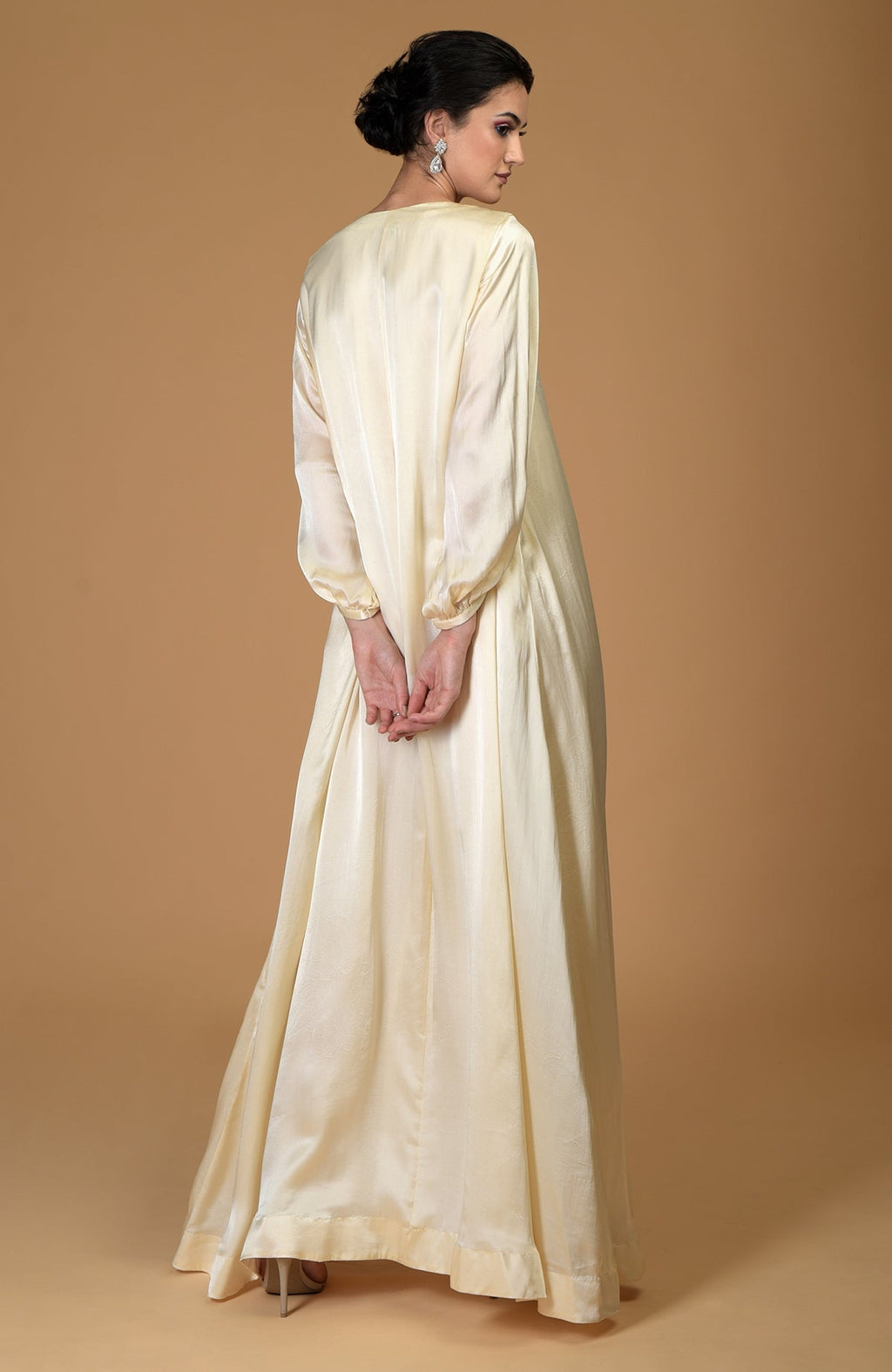 White gold crystal cluster hand embroidered dress with long sleeves.