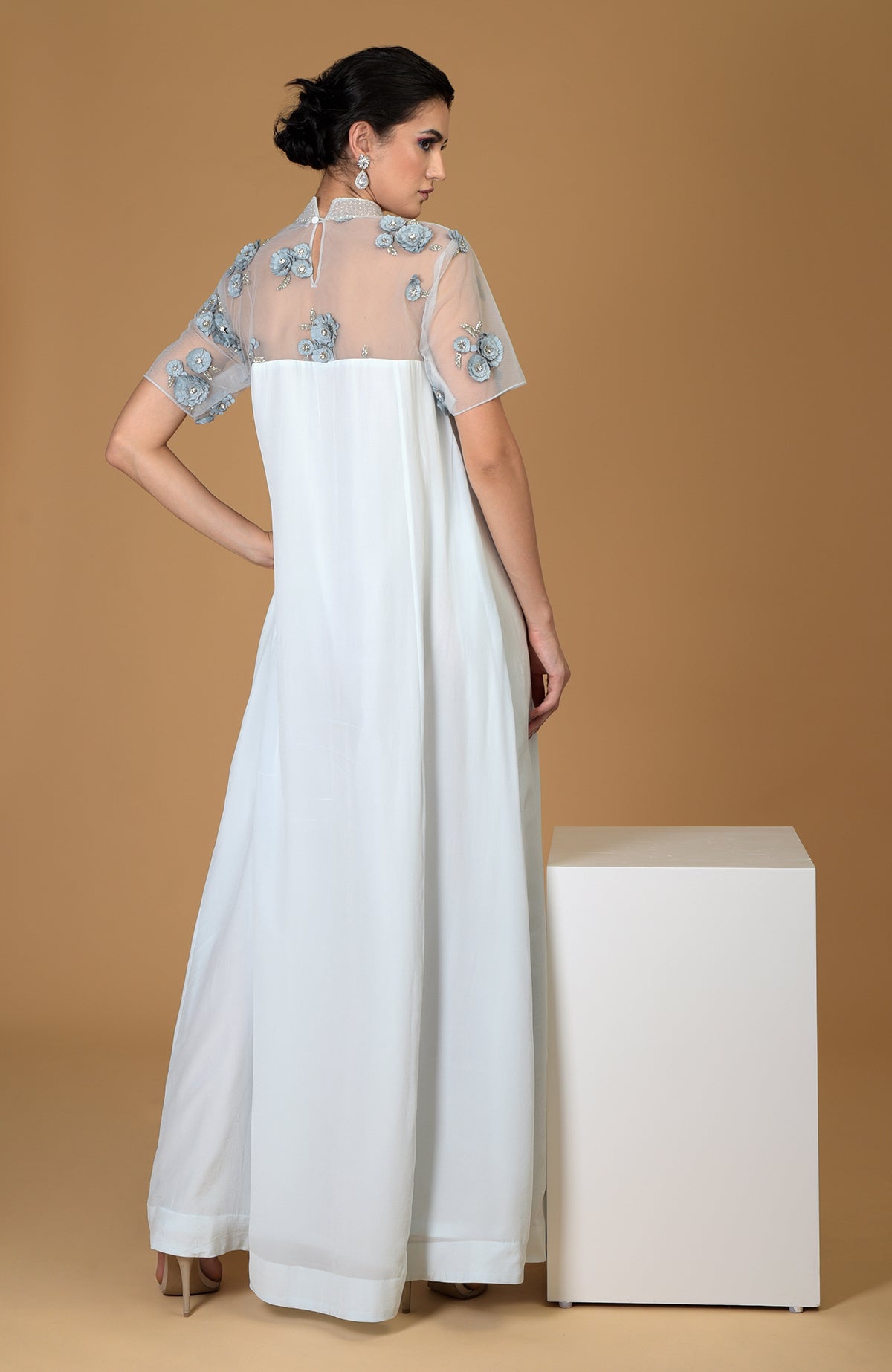Blue twilight hand-embroidered dress with sheer floral bodice.
