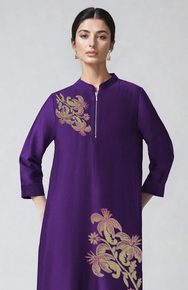 Eggplant kaftan with band collar, zip placket, and Kashmiri tilla aari embroidery.