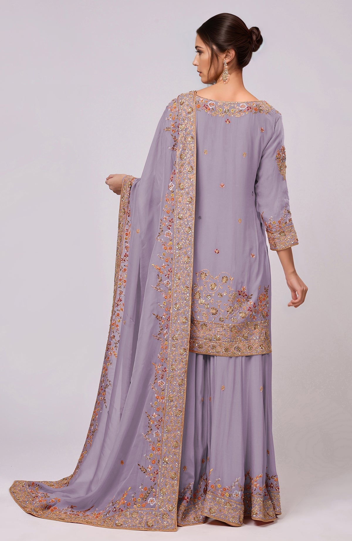 A woman models an Elder Berry Marori and Resham Hand Embroidered Sharara Set.