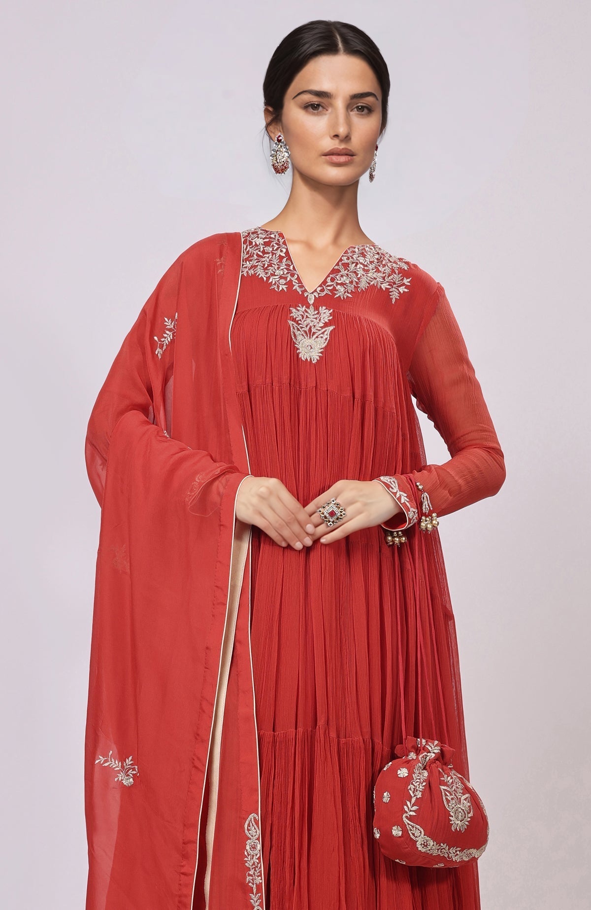 Red Kashmiri Tilla Aari embroidered Anarkali with tiered skirt, churidar, and embroidered dupatta.