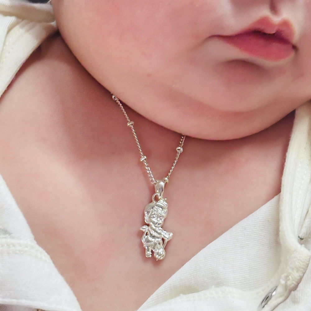 Handmade silver jewelry with beaded design elements, styled with ethnic outfit
