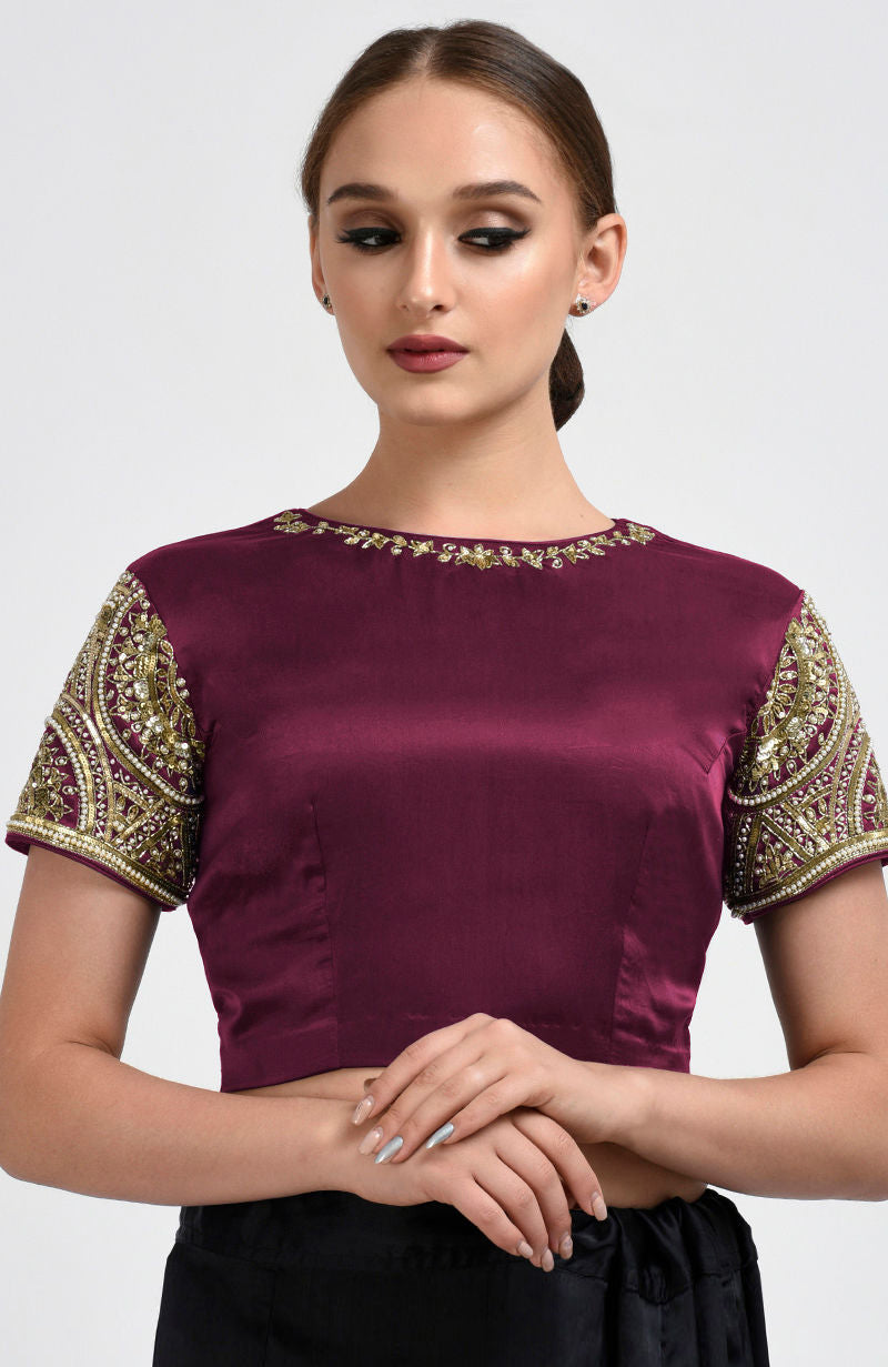 Burgundy satin silk blouse with zardozi and pearl bead hand embroidery on sleeves and neckline.