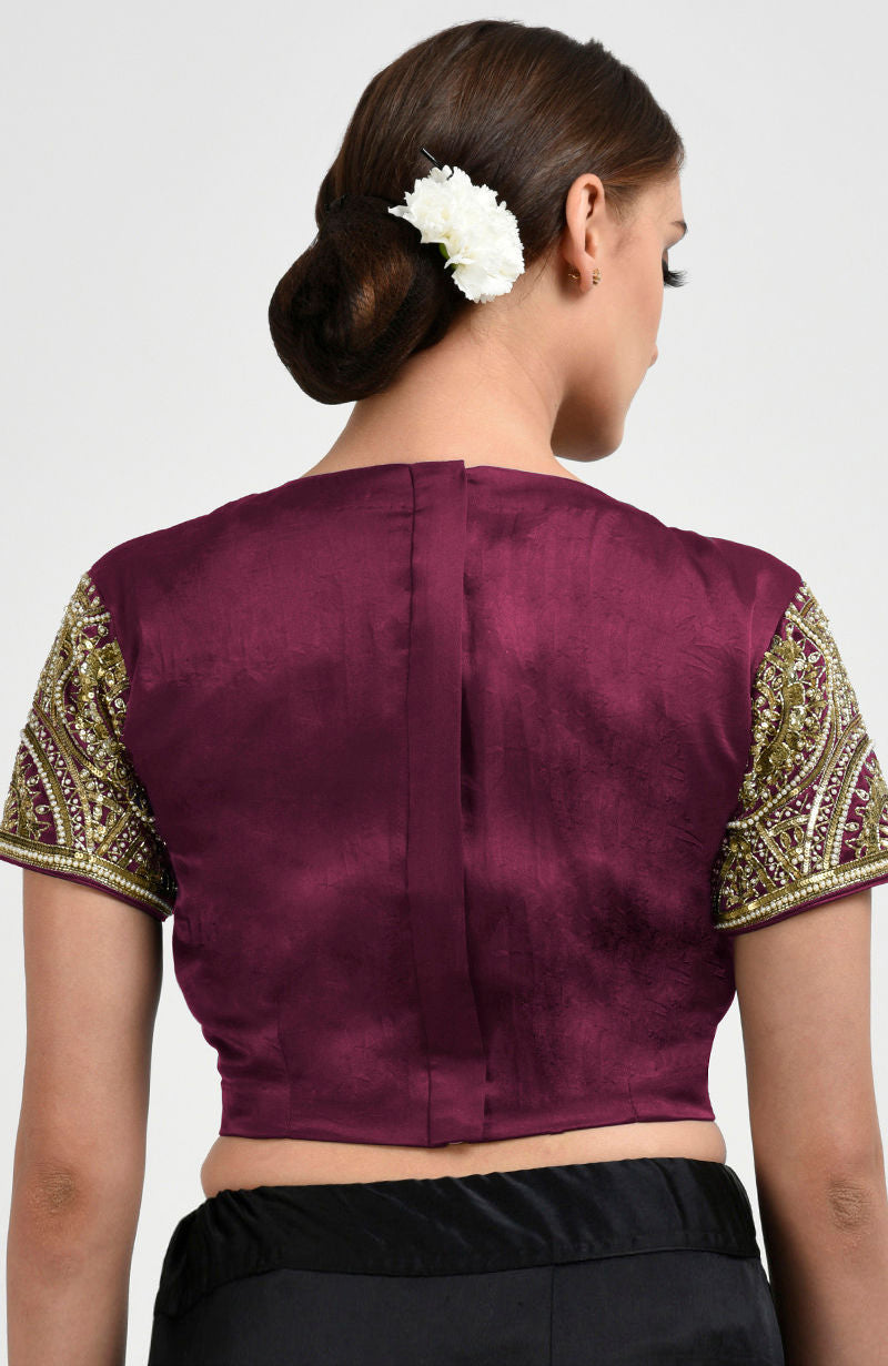 Burgundy satin silk blouse with zardozi and pearl bead embroidered sleeves.