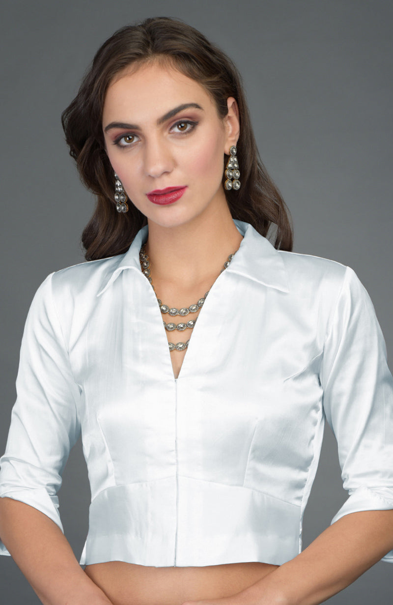 Silvery white pure satin silk collared blouse with a V-neck and three-quarter sleeves.