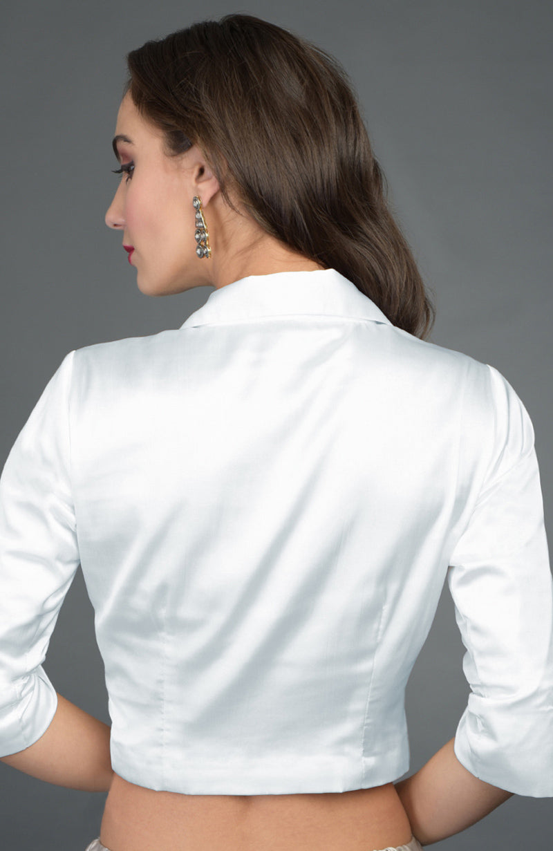 Silvery white pure satin silk collared blouse on a model, viewed from the back.