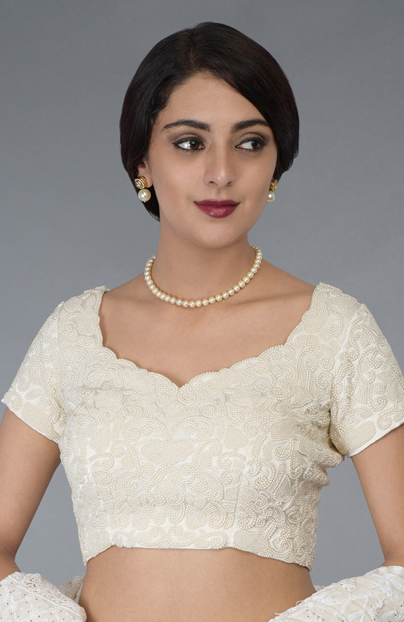 Ivory pearl beaded hand embroidered blouse with a sweetheart neckline.
