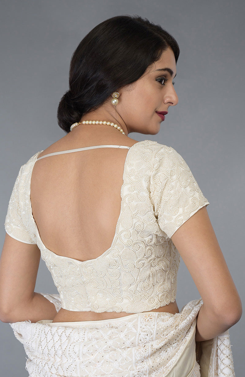 Ivory pearl beaded hand embroidered blouse with a deep back and cap sleeves.