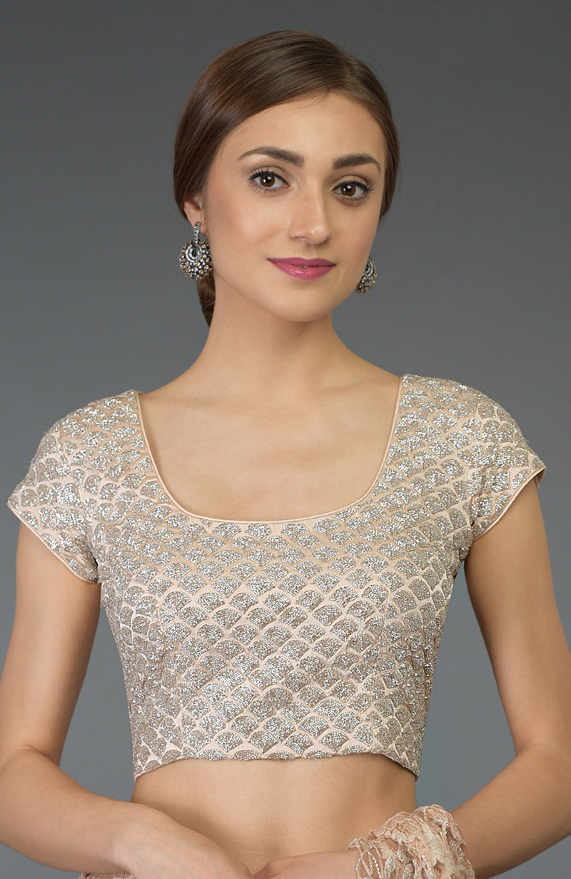 Nude peach zardozi hand embroidered blouse with a U-shaped neckline.