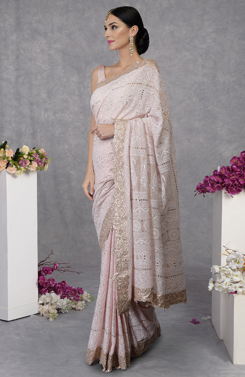 Nude pink georgette saree with intricate hand-embroidered Chikankari and rose gold gota patti borders