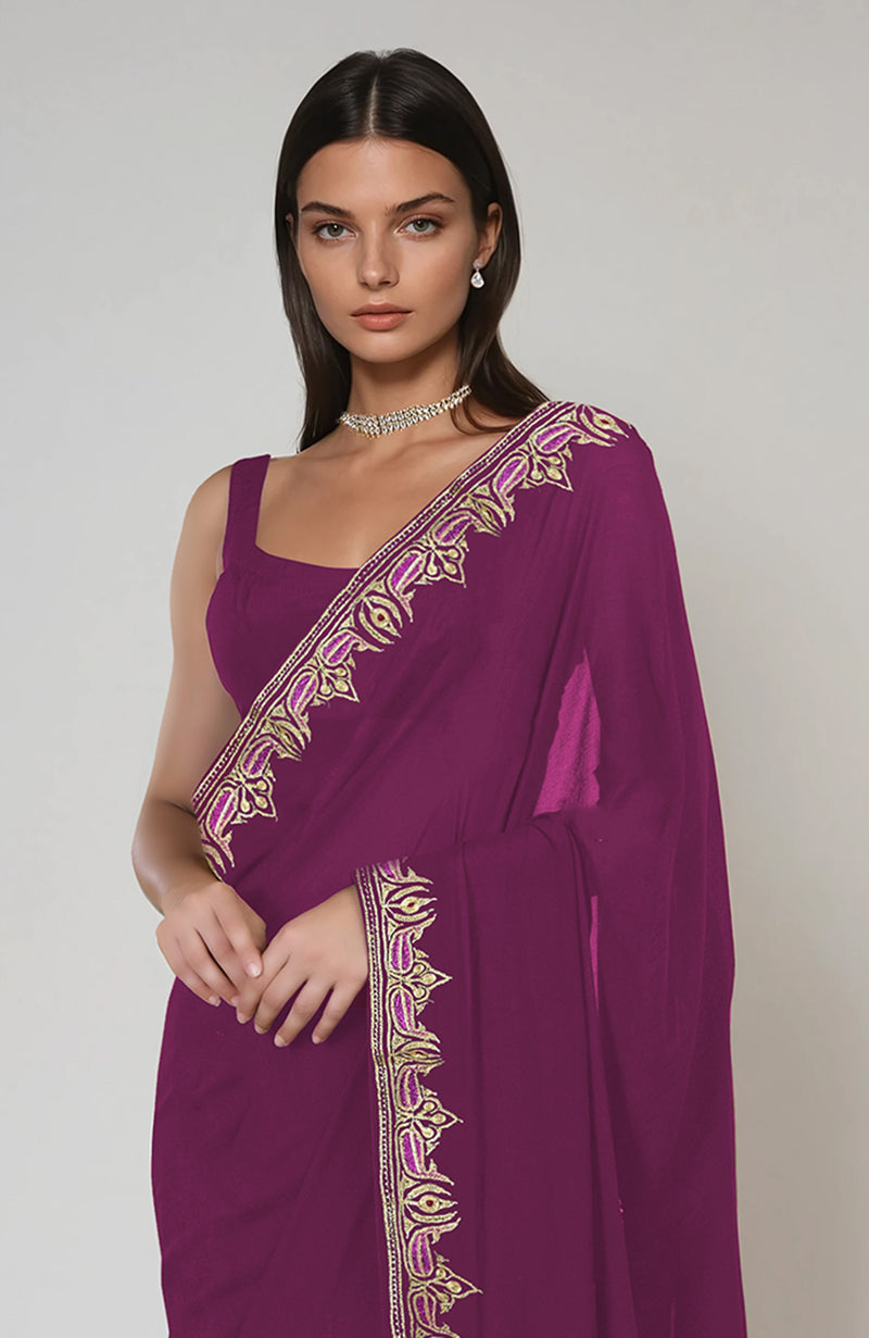 Peacock pink Kashmiri Tilla and Resham embroidered saree with a matching blouse.