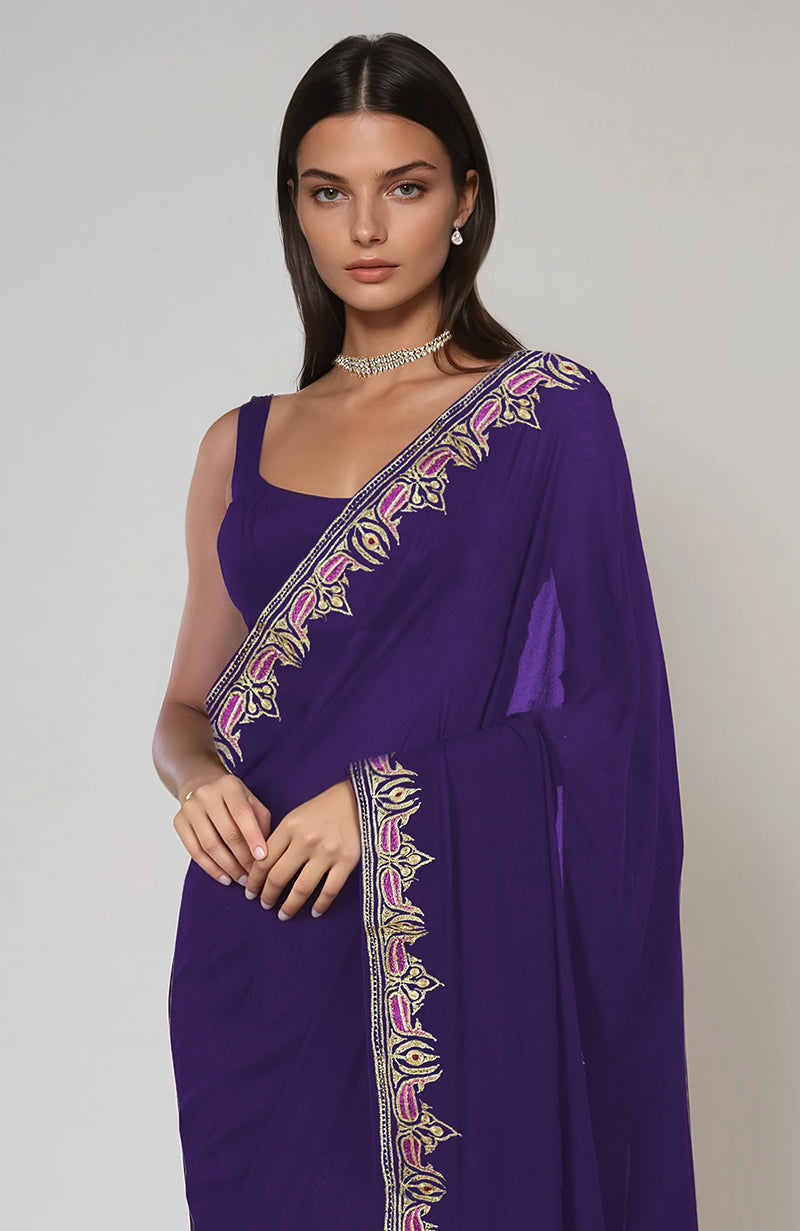 Indigo purple saree with intricate Kashmiri tilla and resham embroidered paisley motifs.