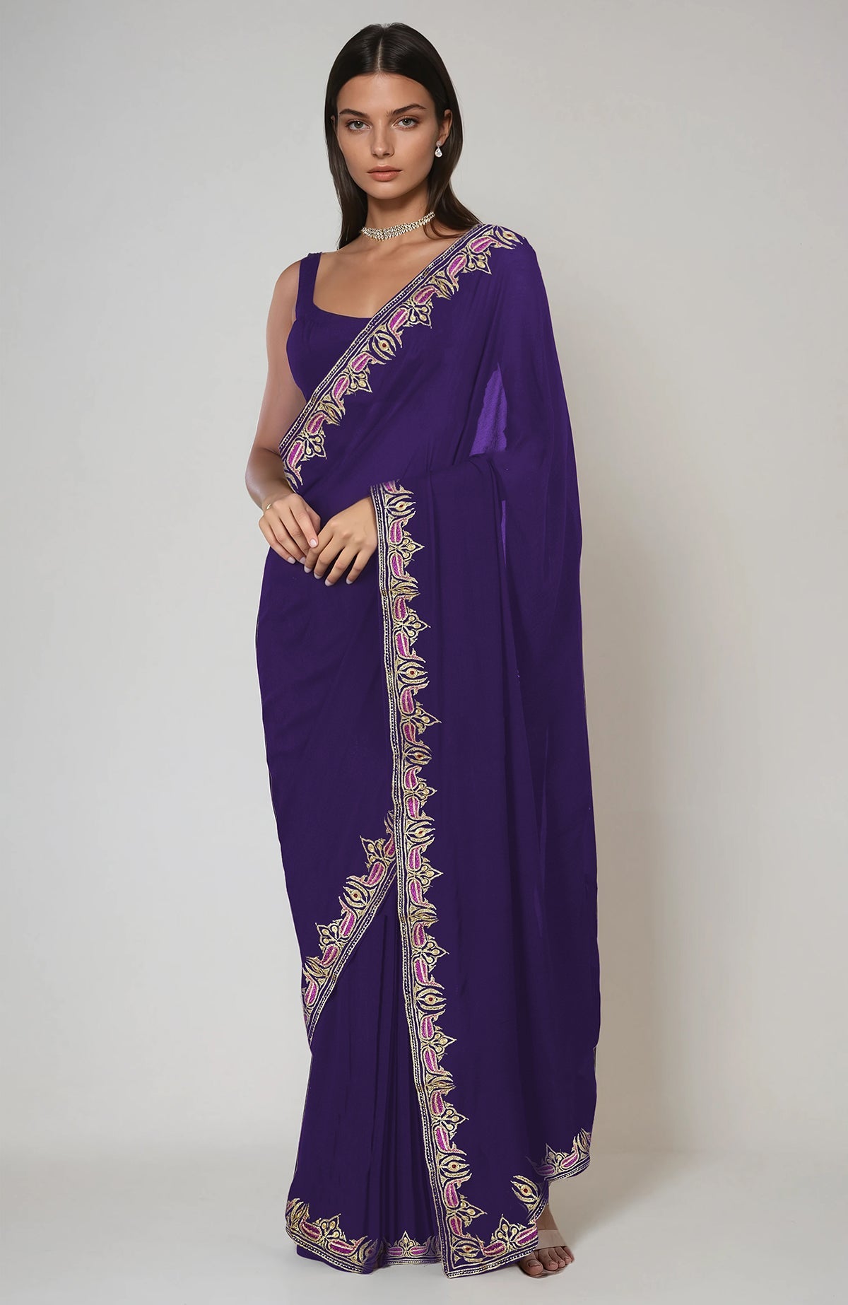 An indigo purple saree with intricate Kashmiri tilla and resham embroidery.