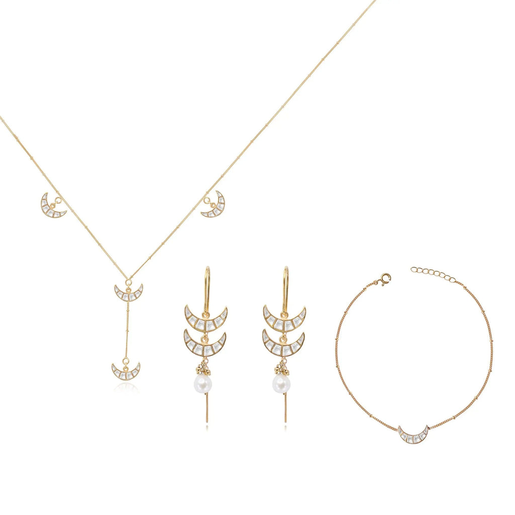 Unniyarcha 92.5 pure silver Chand (moon-shaped) jewelry set, with intricate traditional motifs in earrings and pendant.