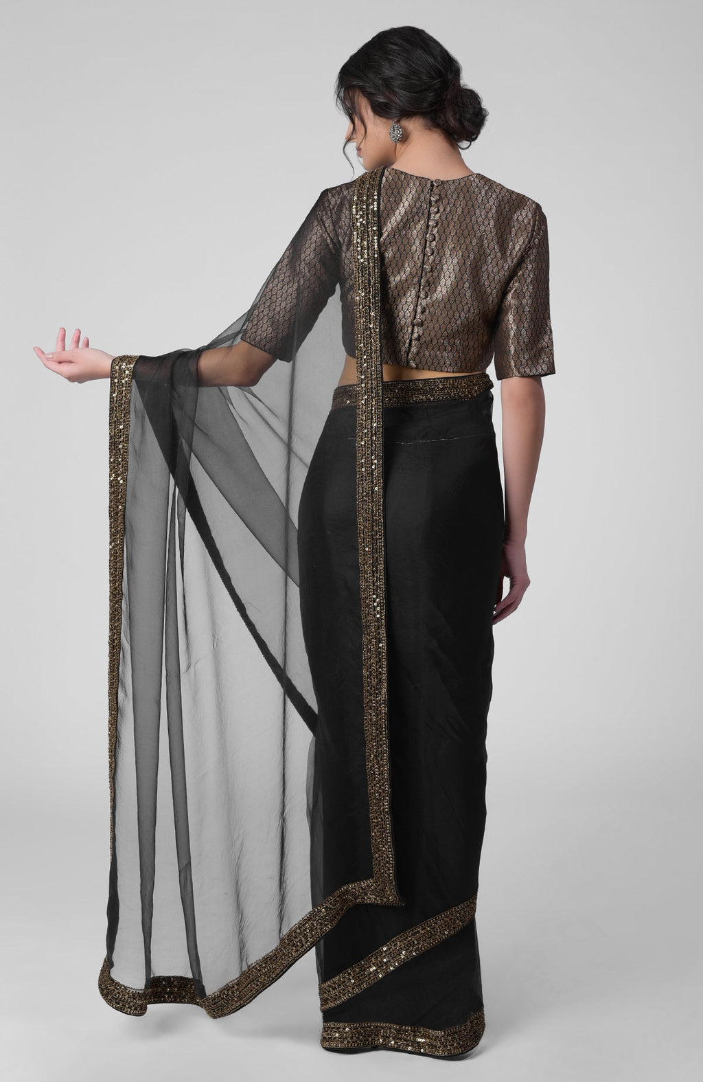 Black silk organza saree with gold zardozi embroidery and silk brocade blouse with jewel neckline