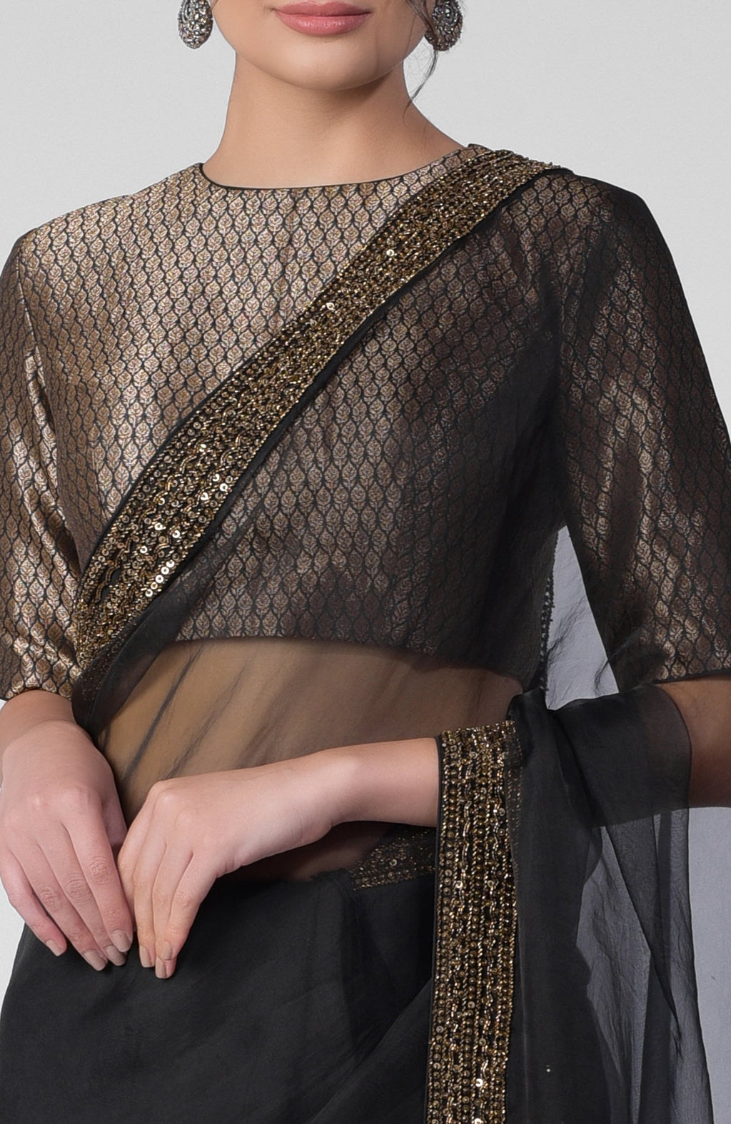Black silk organza saree with gold hand embroidered zardozi border and brocade blouse