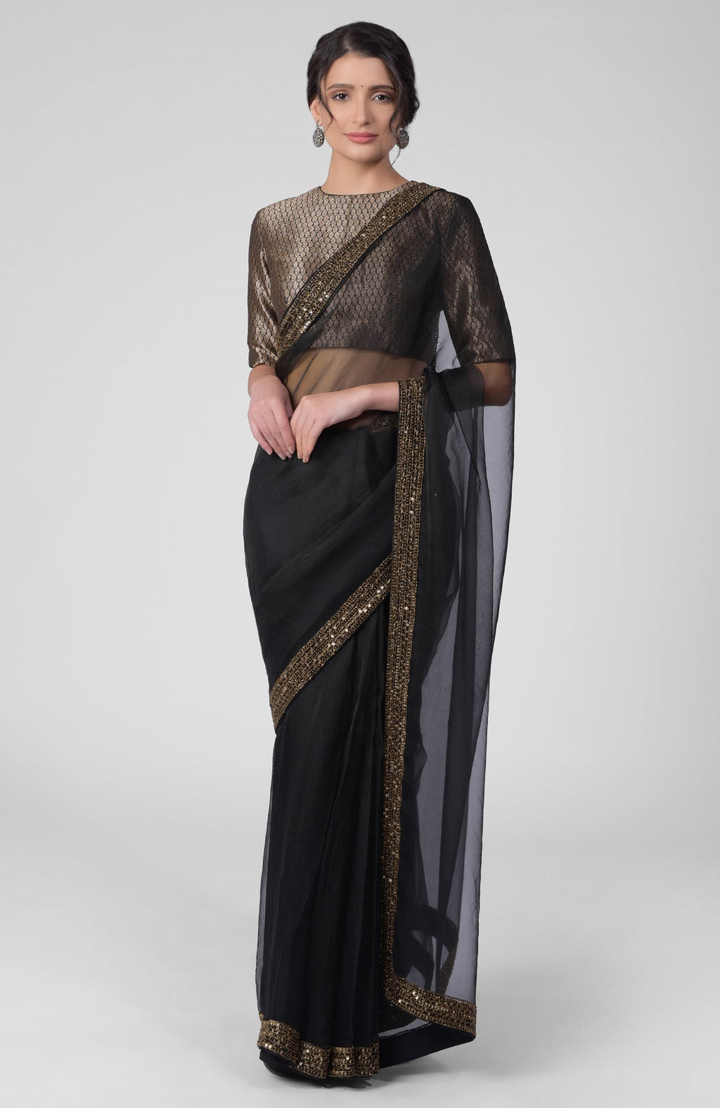 Black silk organza saree with gold hand embroidered zardozi border and brocade blouse