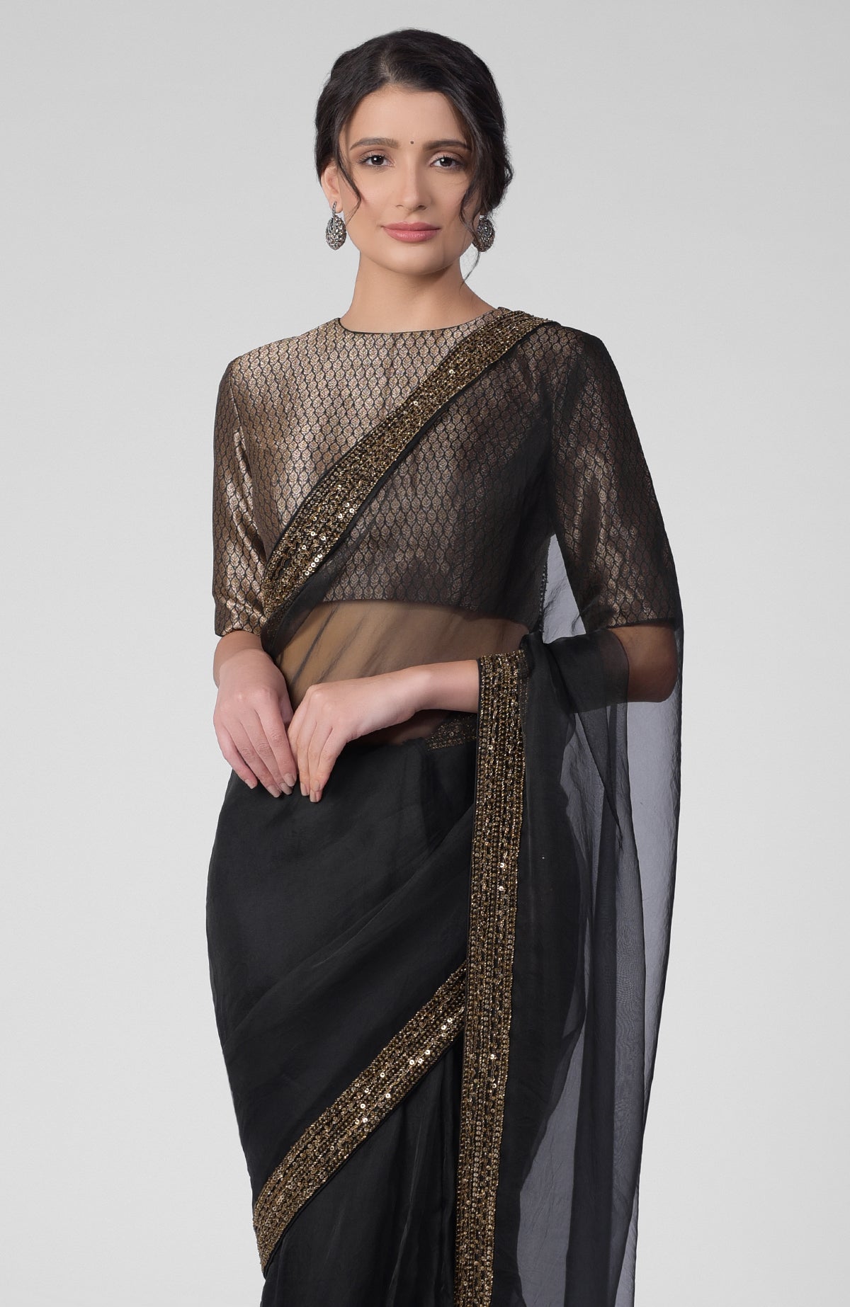 Black silk organza saree with gold hand embroidered zardozi border and brocade blouse