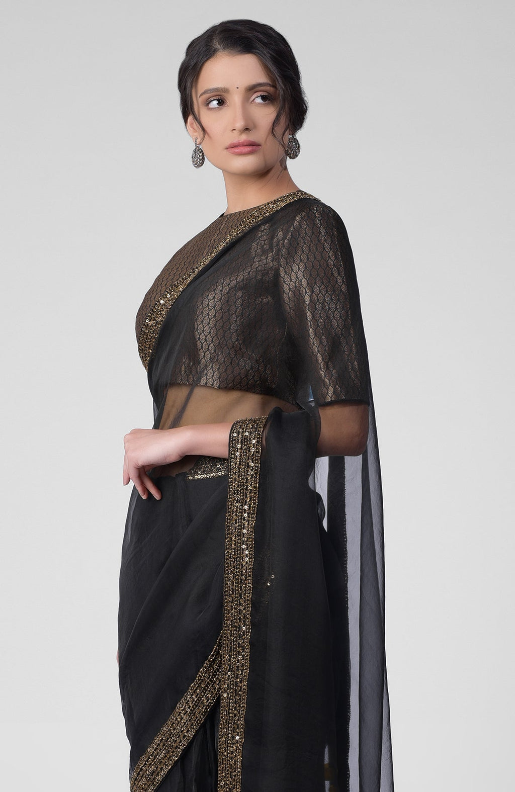 Black silk organza saree with gold hand embroidered zardozi border and brocade blouse