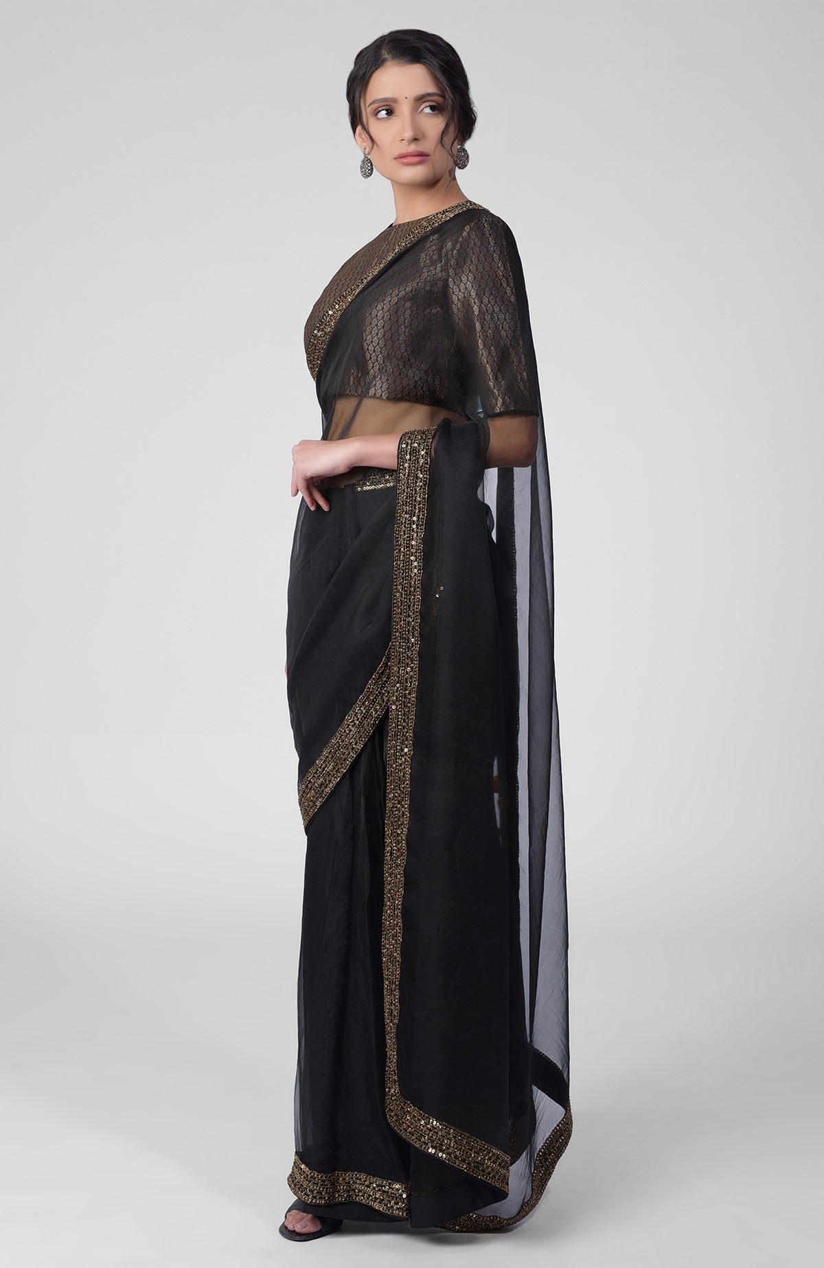 Black silk organza saree with gold hand embroidered zardozi border and brocade blouse