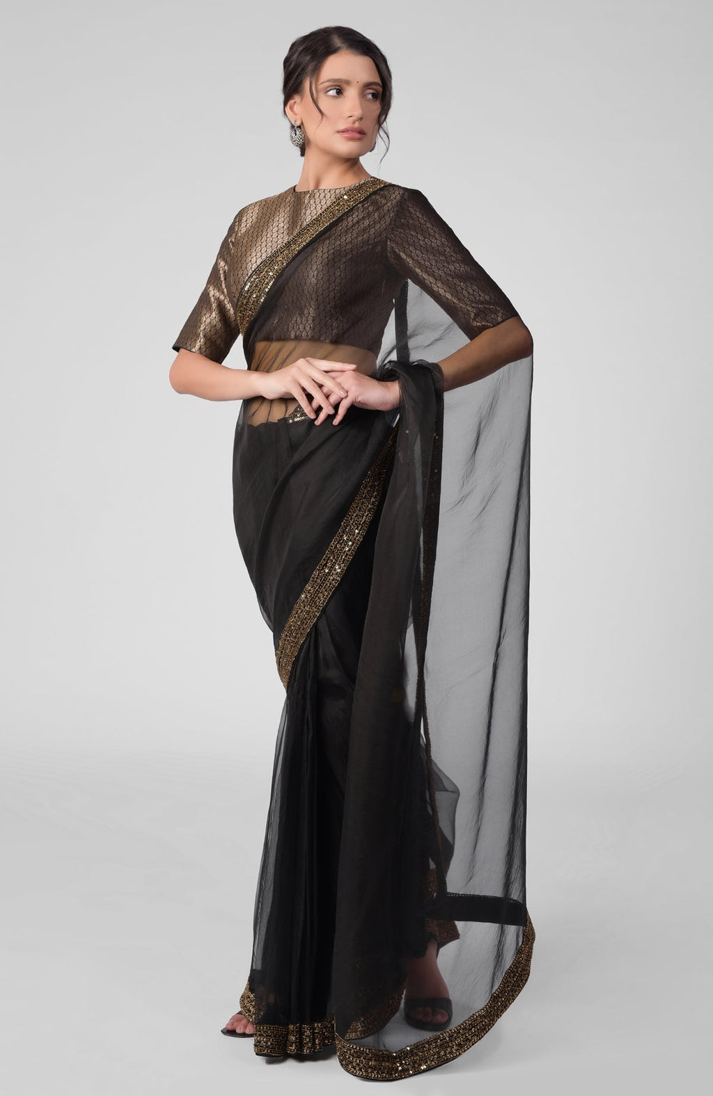 Black silk organza saree with gold zardozi embroidery and silk brocade blouse with jewel neckline