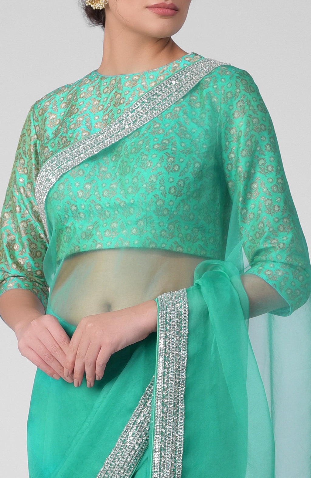 Mint hand-embroidered zardozi saree with a brocade blouse.