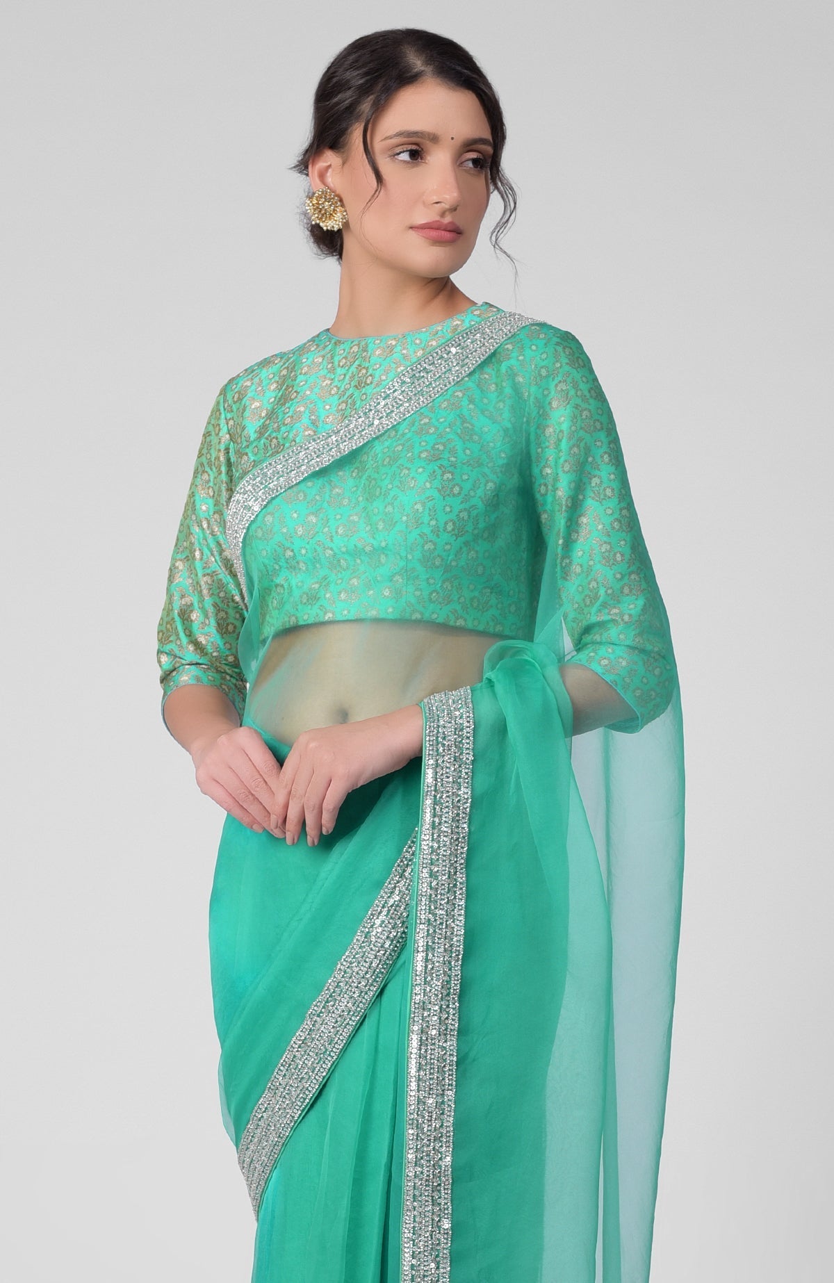 Mint hand-embroidered zardozi saree with a brocade blouse.