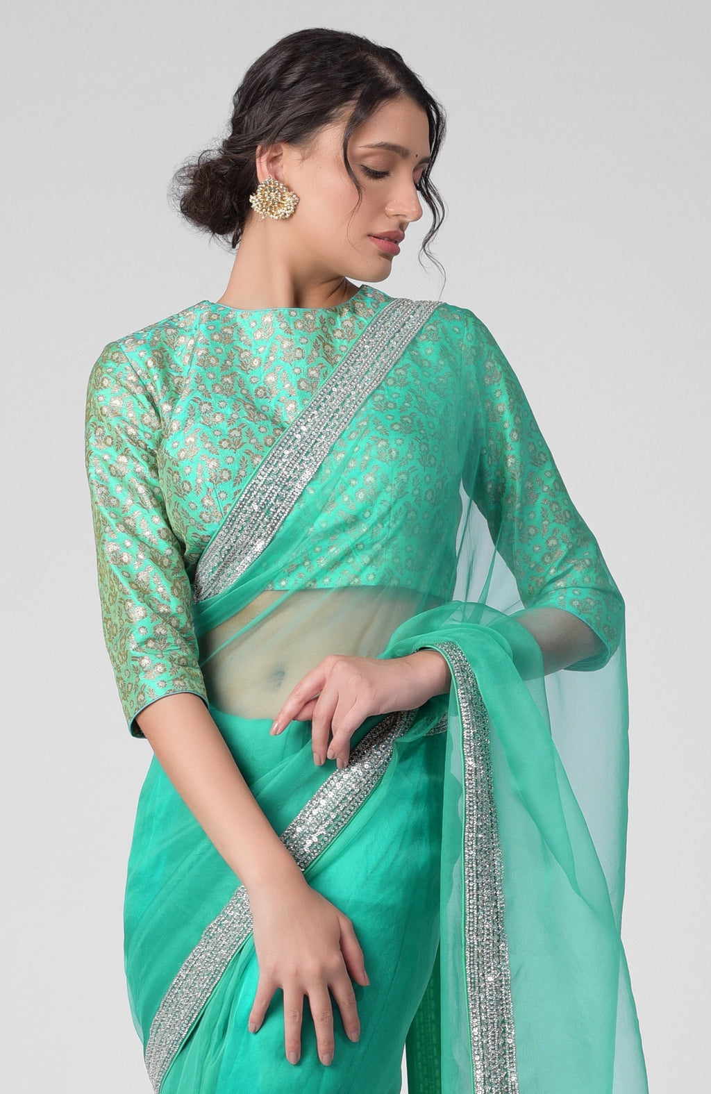 Mint hand-embroidered zardozi saree with a brocade blouse.