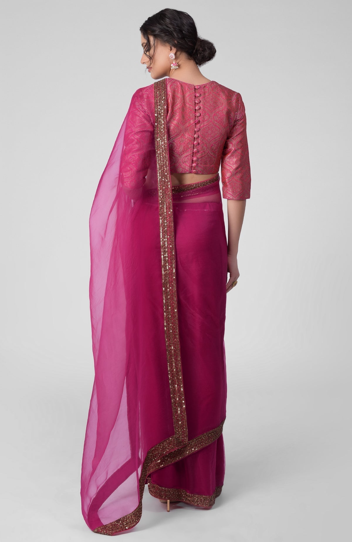 Fuchsia silk organza saree with gold zardozi embroidery and silk brocade blouse with jewel neckline