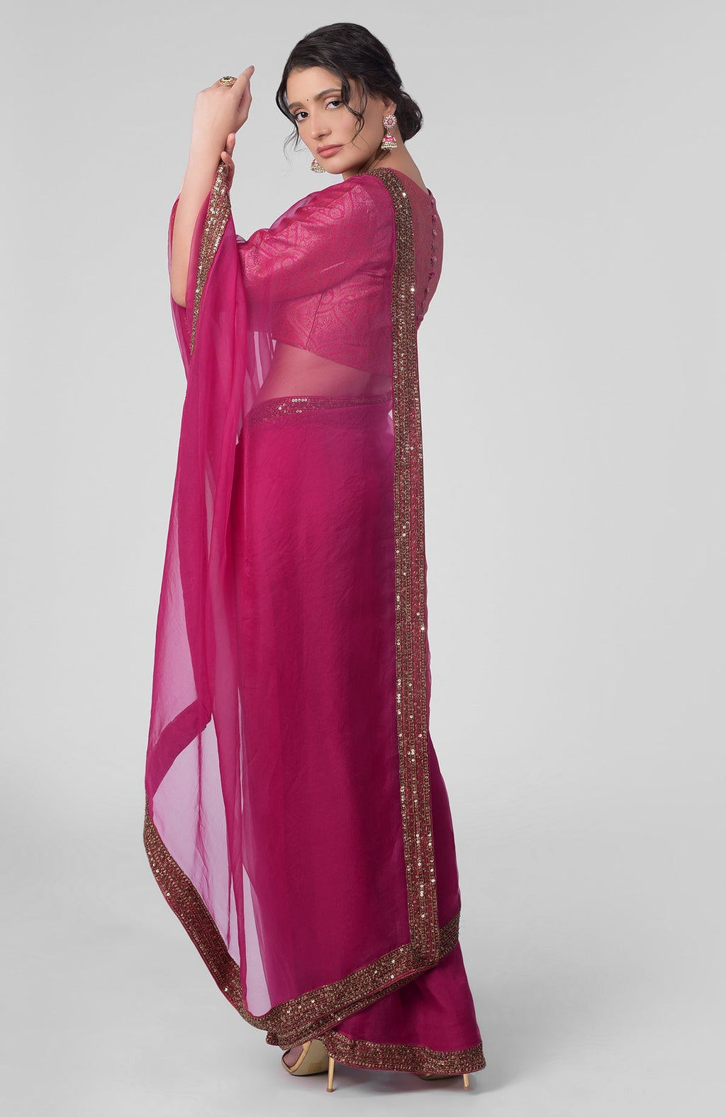 Fuchsia silk organza saree with gold zardozi border and silk brocade blouse with jewel neckline
