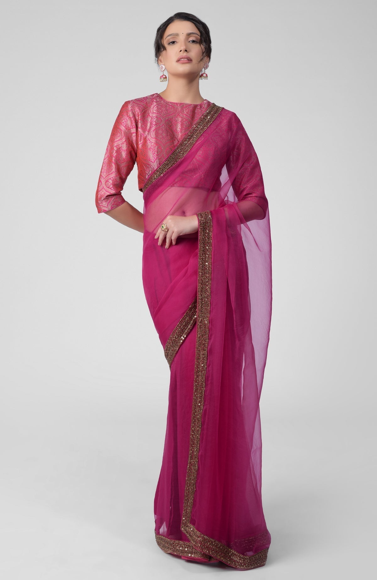 Fuchsia silk organza saree with gold zardozi embroidery and silk brocade blouse with jewel neckline