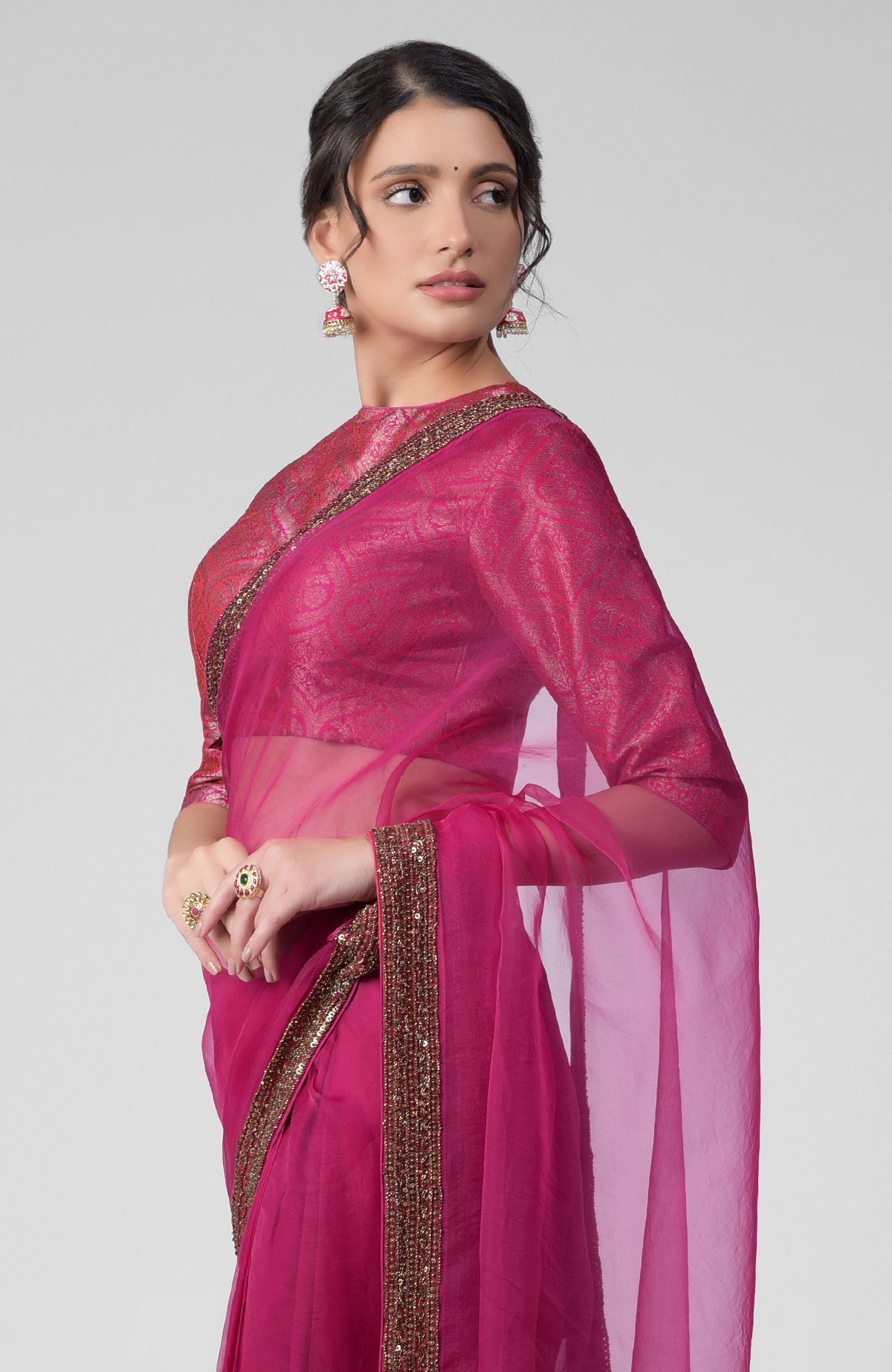 Fuchsia silk organza saree with gold zardozi embroidery and silk brocade blouse with jewel neckline