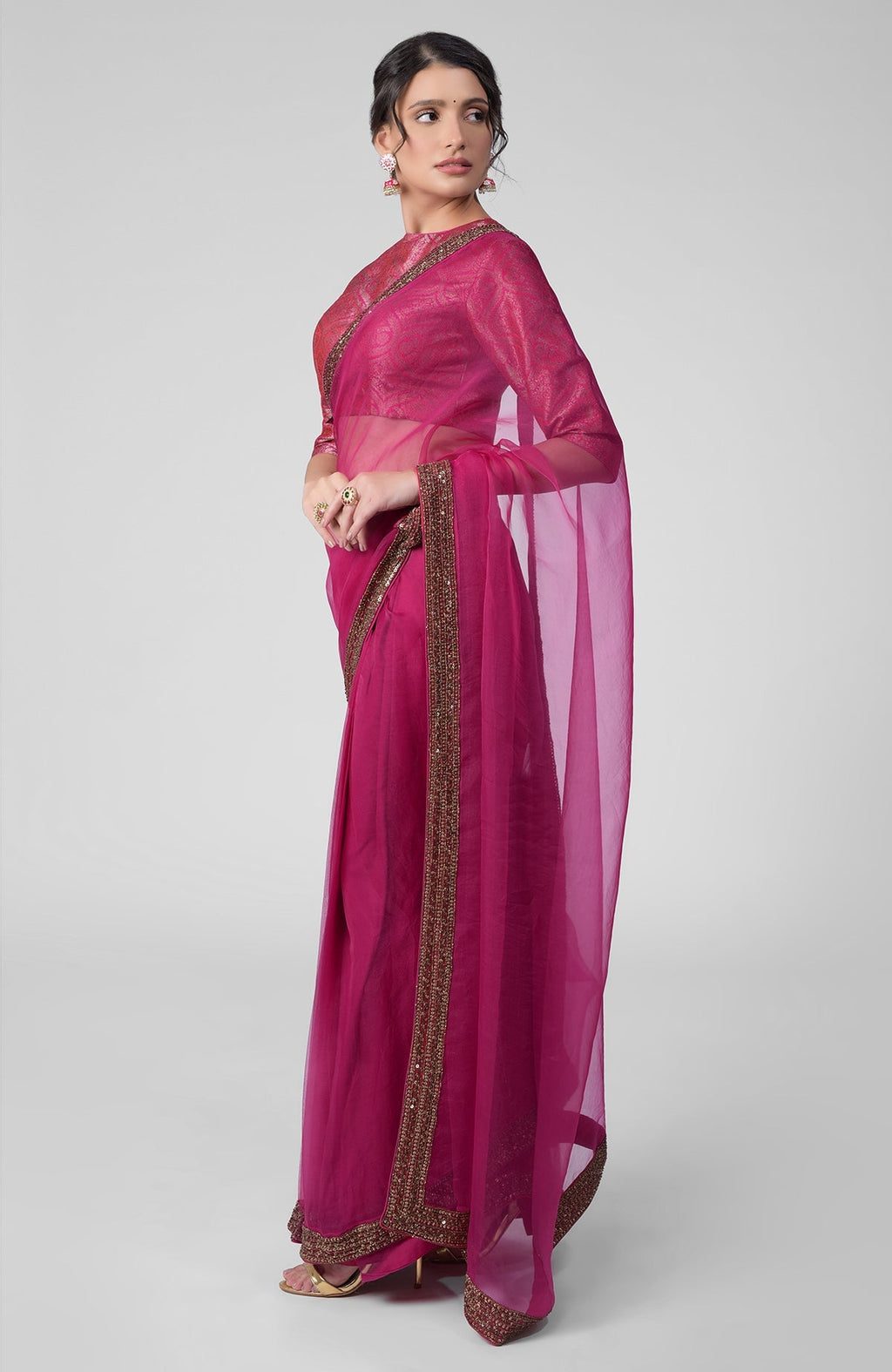Fuchsia silk organza saree with gold zardozi border and silk brocade blouse with jewel neckline