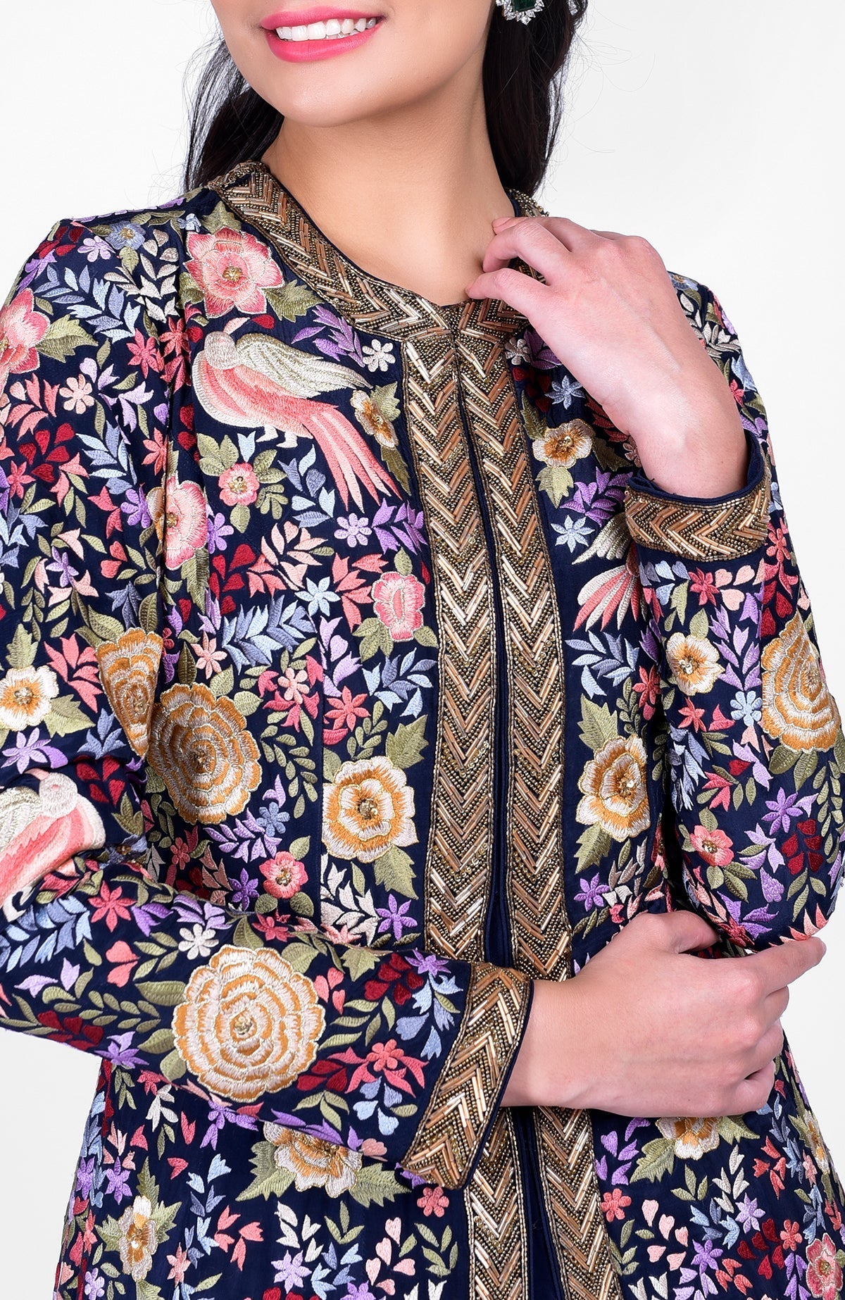 Navy blue jacket with multicolor Parsi Gara embroidery and gold zardozi paired with ivory pants