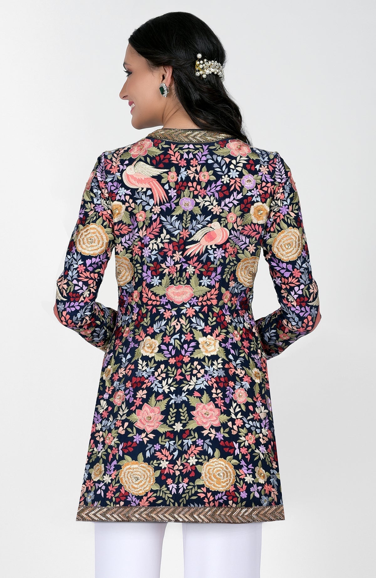 Navy blue Parsi Gara jacket with multicolor silk embroidery and gold zardozi borders paired with ivory pants