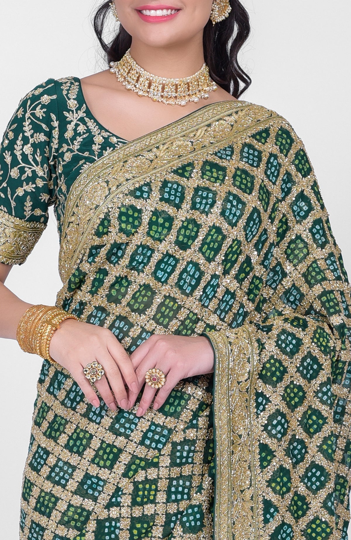Bottle green Bandhej saree with Banarasi zari and zardozi hand embroidery and beadwork blouse.