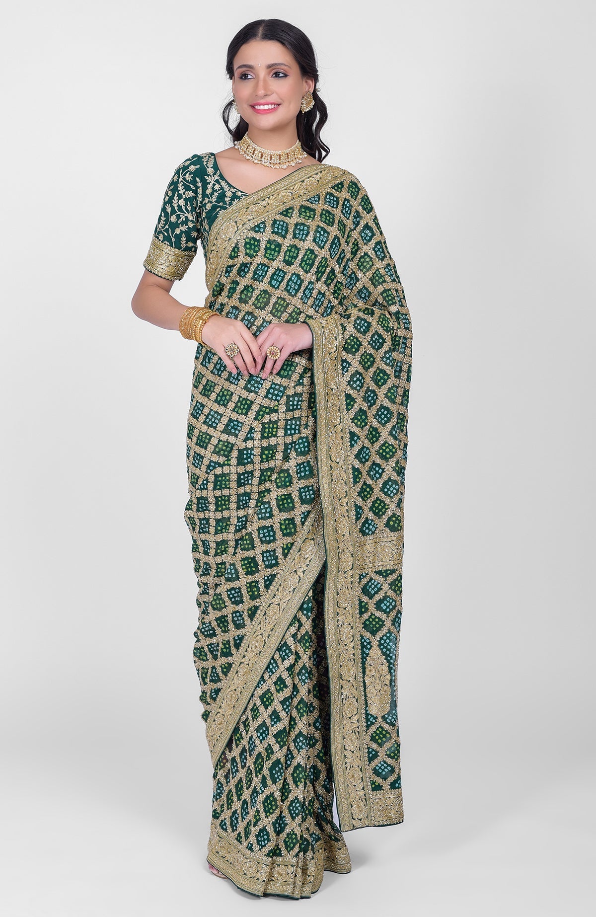 Bottle green Bandhej and Banarasi zari saree with gold zardozi embroidery and beadwork.