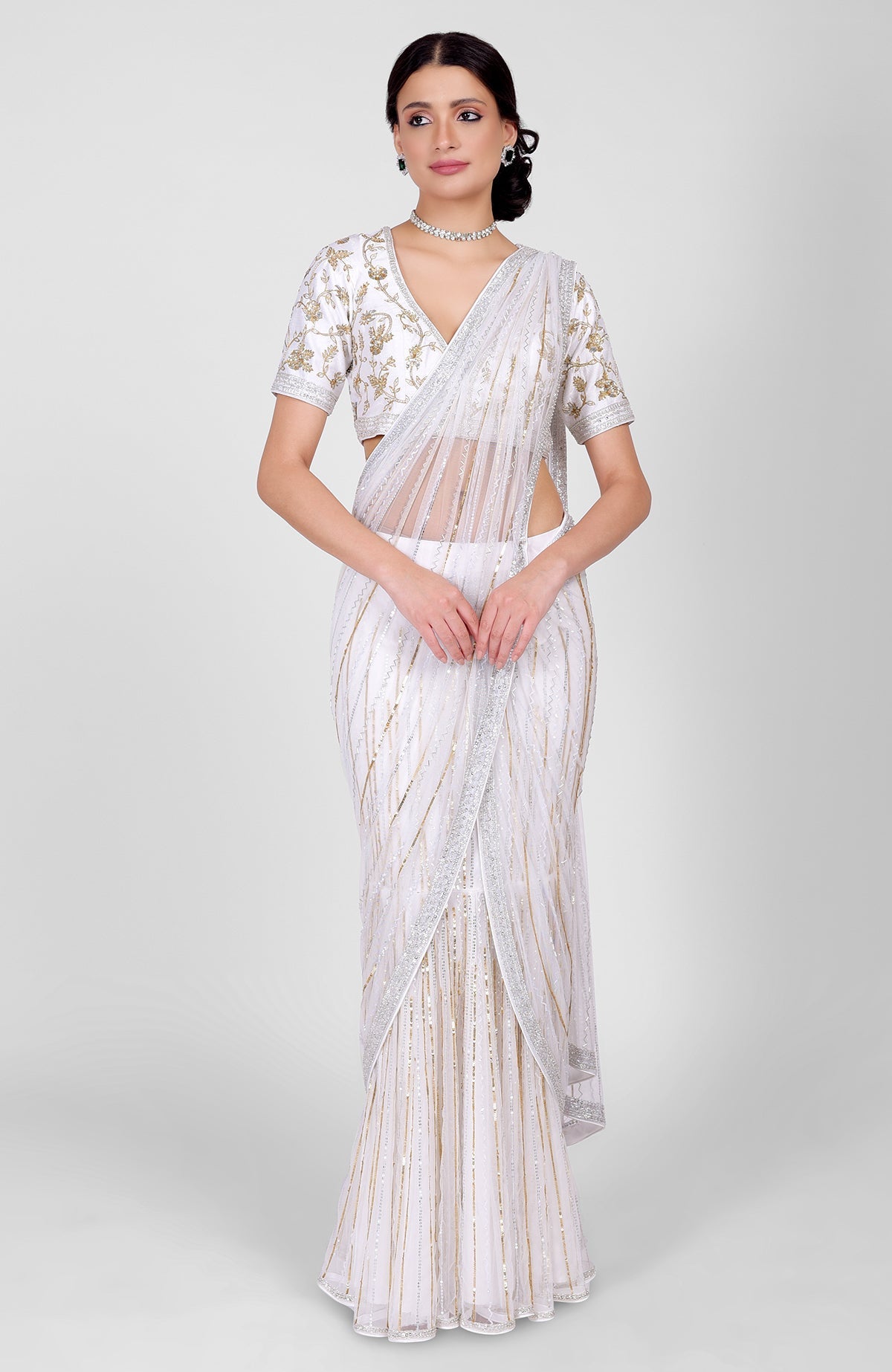 White tulle saree with gold, silver sequins and beads, paired with gold embroidered blouse