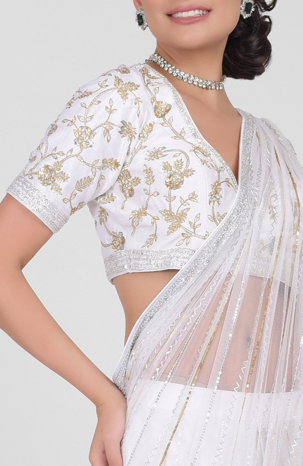 White tulle saree with gold, silver sequins and beads, paired with gold embroidered blouse