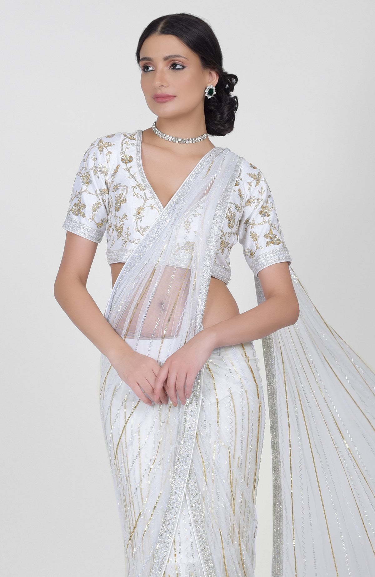 White tulle saree with gold, silver sequins and bead embroidery paired with gold zari blouse