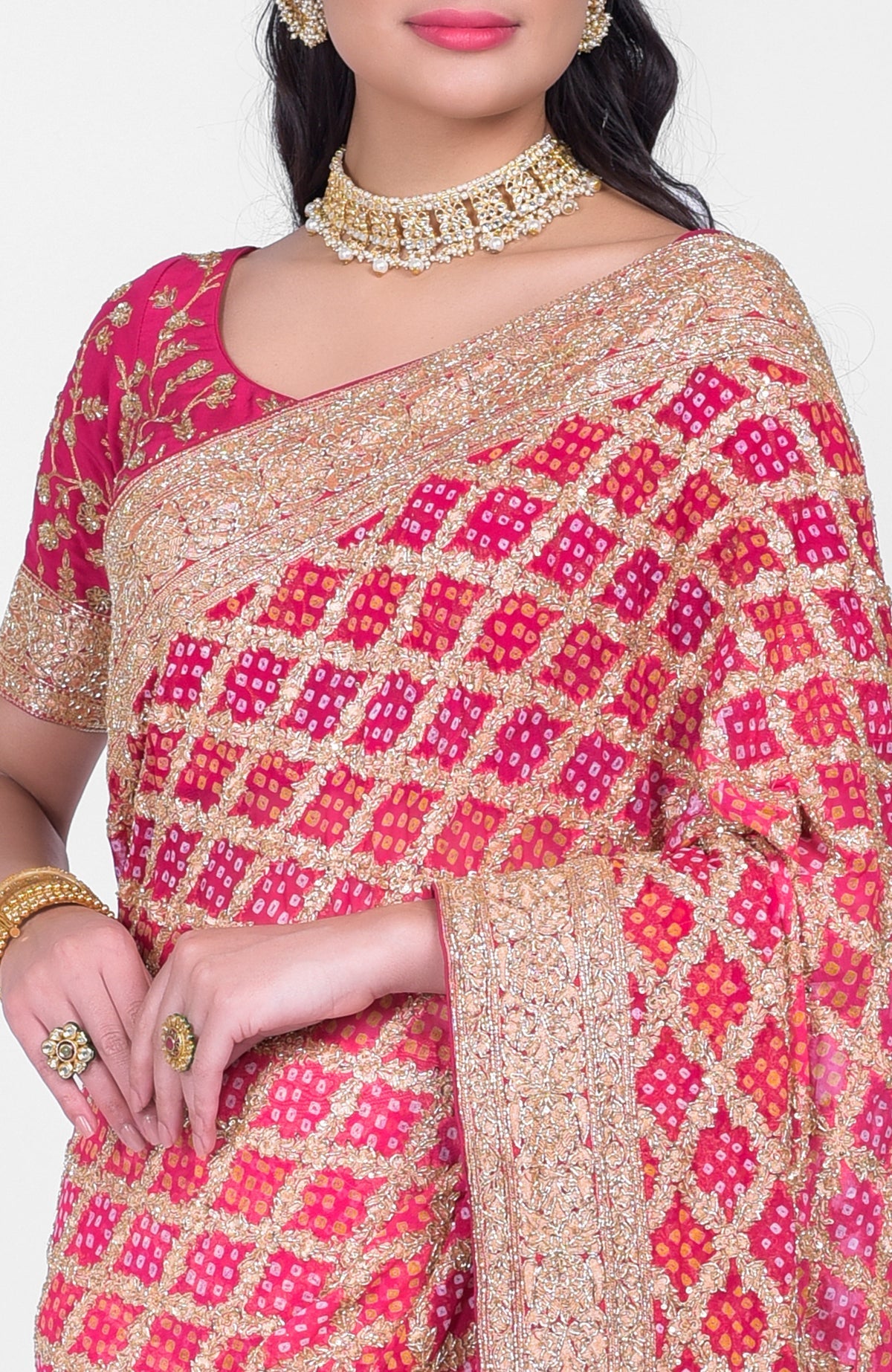 Pink-red ombre saree with Bandhej, Banarasi zari, and gold zardozi hand embroidery.