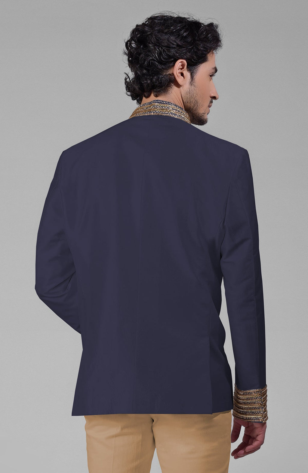 Midnight blue silk bandhgala jacket with zardozi embroidery, beadwork, sequins, and gold buttons